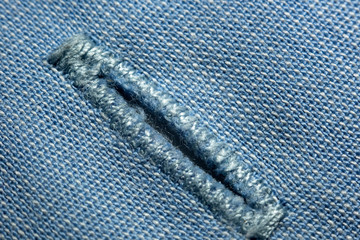 Buttonhole on cotton cloth, macro