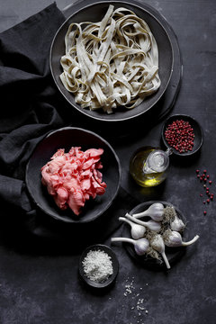 Ingredients for pasta, pink oyster mushrooms and garlic