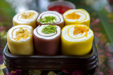 Roll crepes with whipped cream with thai dessert