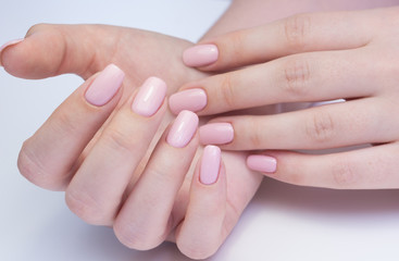 Fototapeta na wymiar Amazing natural nails. Women's hands with clean manicure. Gel polish applied.