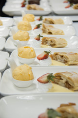 Apple strudel with ice cream and strawberry