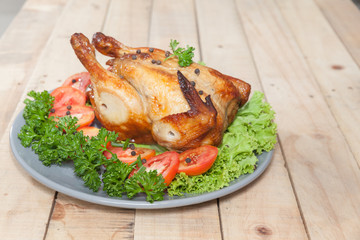 grilled chicken on wooden table