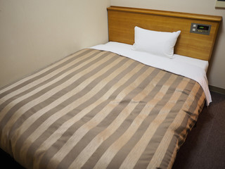 Comfortable bed with the gold straight line overlay