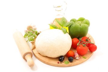 raw dough pizza with ingredients