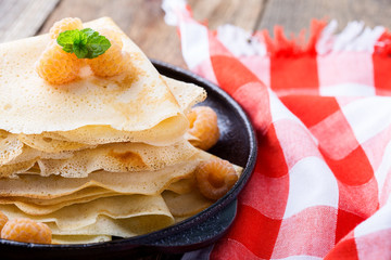 Homemade  crepes served with fresh yelllow raspberries