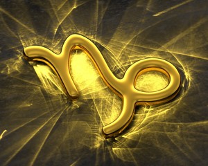 Sign of the zodiac in gold with caustics - Capricorn