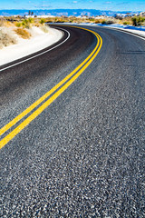 Yellow stripes on asphalt road