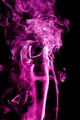Obraz premium Abstract color smoke on black background, purple smoke background,purple ink background,Violet smoke, beautiful color smoke