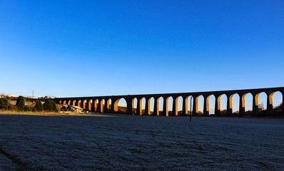 Winter's sunset view of the frosty Culloden Viaduct also known as the Clava Viaduct or the Nairn...