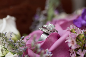 Beautiful wedding rings perched in lavender flowers