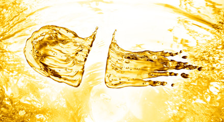 oil splash on gold bokeh background