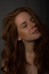 sensual portrait of a redheaded beautiful woman