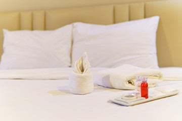 bathroom accessories preparation on the bed in a room of hotel or apartment. well and nice preparation of bath facilities for hotel services. set of bath services on the bed in hotel.