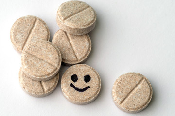 pharmaceutical tablet with a smile face