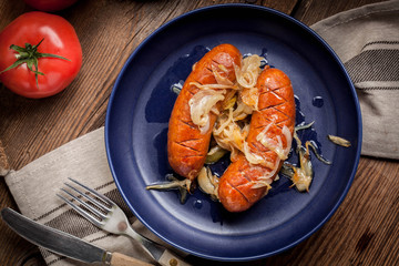 Fried sausage with onions.
