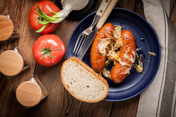 Fried sausage with onions.