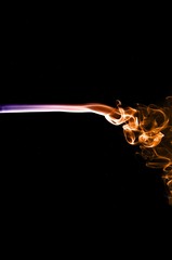 Abstract colorful smoke on black background, colorful ink background,Violet,purple, Orange, beautiful smoke