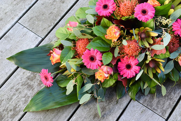 Top view of fresh flowers for cemetery or funeral. Close up of modern art creation of flowers