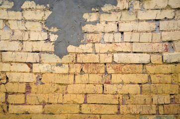 Yellow brick wall background.Home repair.
