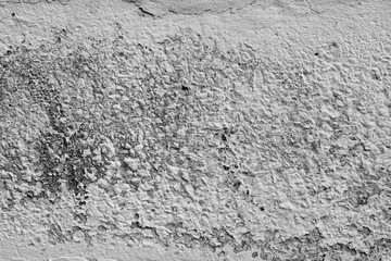 Wall fragment with scratches and cracks
