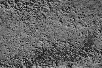 Wall fragment with scratches and cracks