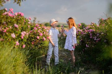 Happy kids on the field of chamomiles