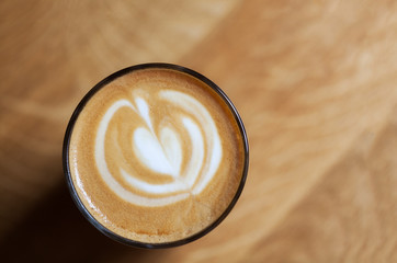 big cup of cappuccino coffee on cafe background