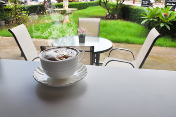 warm cup of coffee in cofee shop