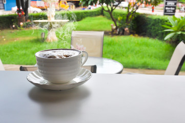 warm cup of coffee in cofee shop