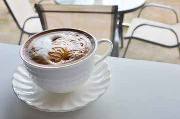 warm cup of coffee in cofee shop
