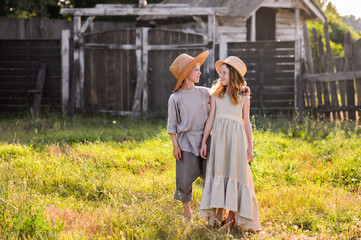 Obraz premium Beautiful children play outdoor. Children in vintage village.