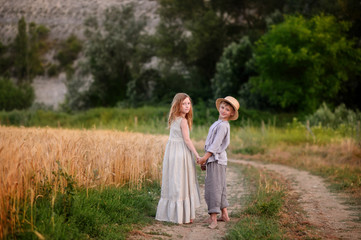Beautiful children play outdoor. Children in vintage village.