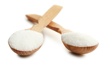 Fototapeta na wymiar Sugar in spoons isolated on white background