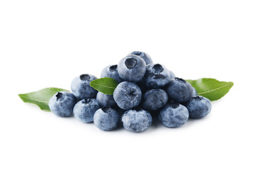 Ripe blueberries with green leafs isolated on white background