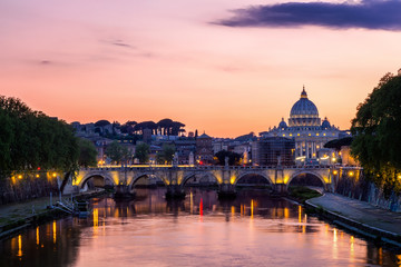 Obraz na płótnie Canvas Vatican City, Rome, Italy, Beautiful Vibrant Night image Panorama of St. Peter's Basilica, Ponte St. Angelo and Tiber River at Dusk in Summer. Reflection of The Papal Basilica of St. Peter