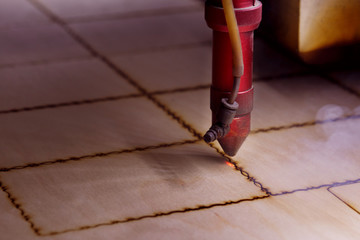 CNC Laser cutting wood. Modern machine industrial technology