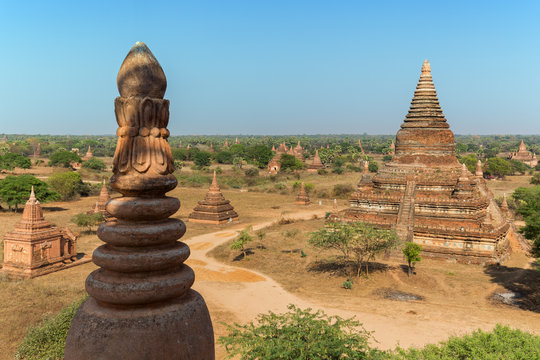 Many old pagodas and other buildings at the ancient plain of Bagan in Myanmar (Burma), viewed from the Bulethi (Buledi) Temple on a sunny day.
