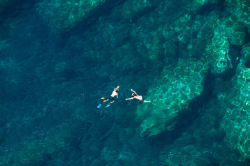Above view of a couple snorkeling in the sea