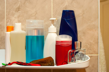 Shelf in the bathroom with hygiene products.