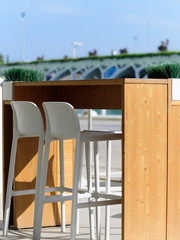 Outdoor restaurant dining table in sun in Valencia city of scince and arts for tow persons. Side view1