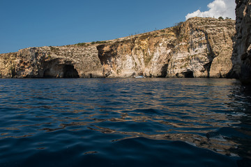 Fototapeta na wymiar Blue grotto seen from a boat trip. Malta