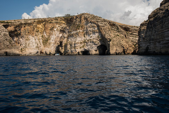 Blue grotto seen from a boat trip. Malta