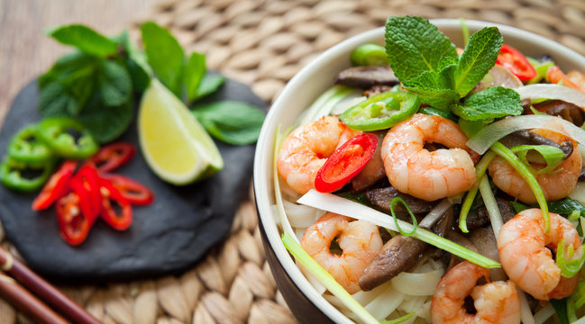 Vietnamese Spicy King Prawn Noodles wirh chili, lime and Shiitake mushrooms .