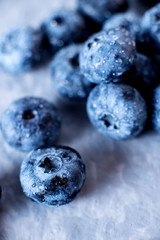 Contrast macro photo food, summer fresh juicy ripe berries, blueberries on gray background