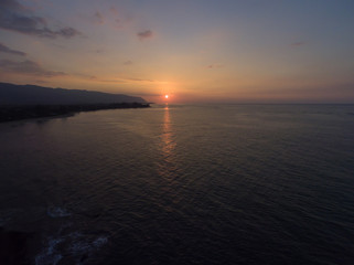 Aerial view of the setting sun at Kaena point on the north shore of Oahu Hawaii