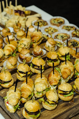 small hamburgers on wooden