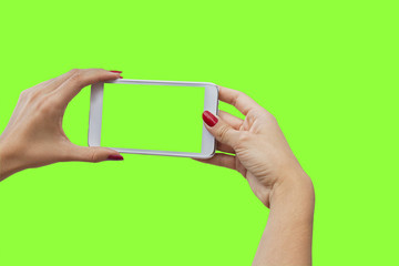 Young girl hand holding mobile smart phone on green screen