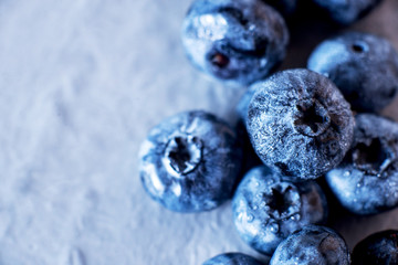 Contrast macro photo food, summer fresh juicy ripe berries, blueberries on gray background