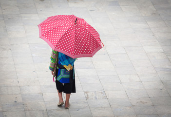hmong girl with big red umbrella in Sa Pa, Lao Cai, Vietnam