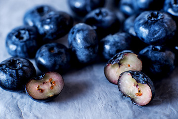 Contrast macro photo food, summer fresh juicy ripe berries, blueberries on gray background